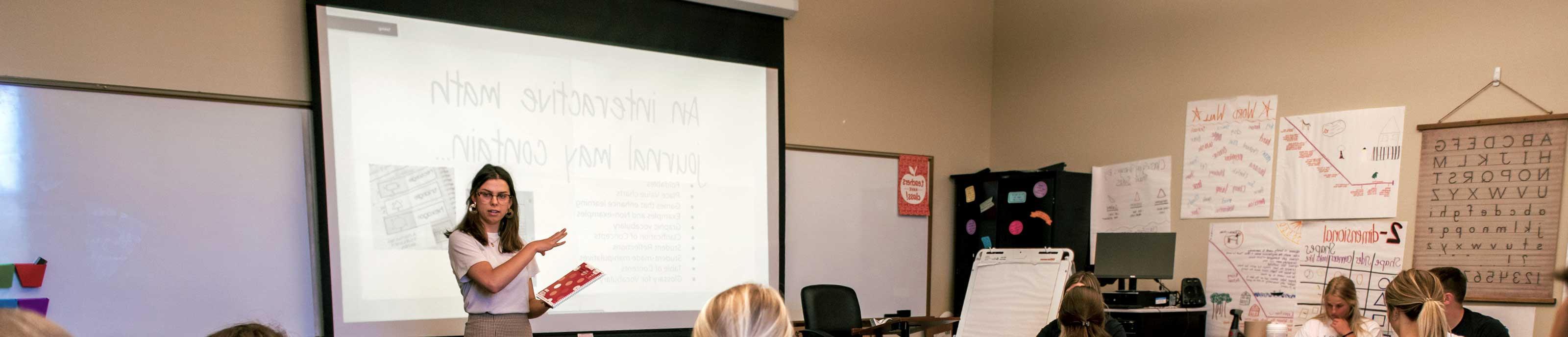 Benedictine College student giving a presentation in the education department